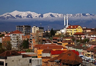 Peshkopi with snow covered mountains in the distance