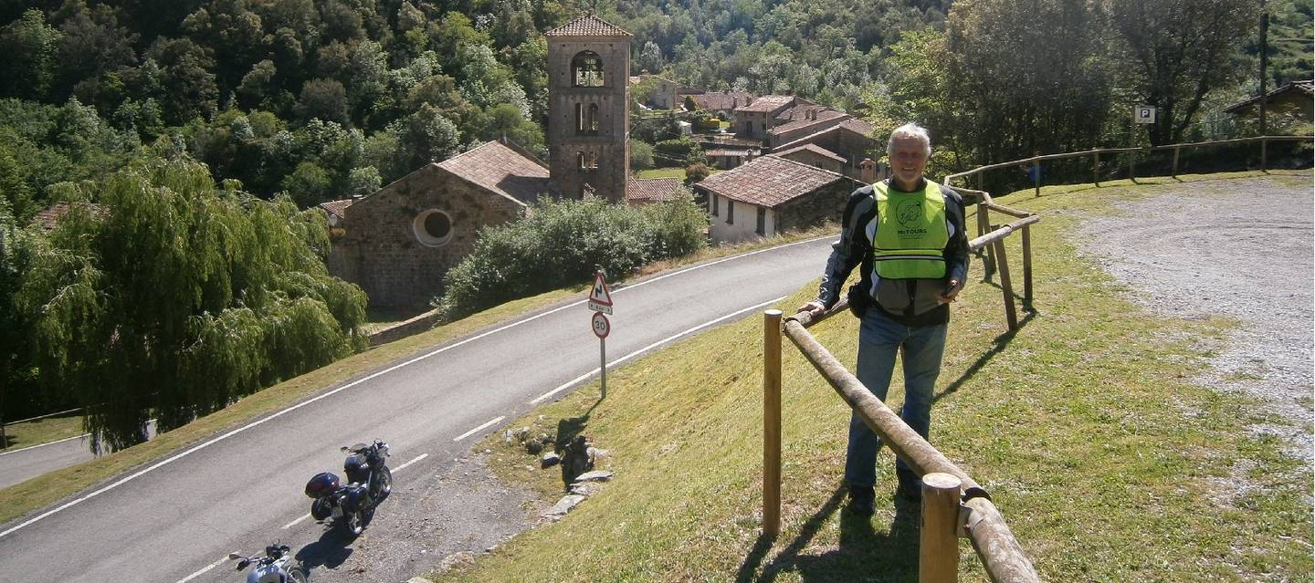 Rider stopped to pose at hairpin bend 