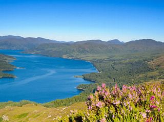 looking down from the mountains onto a Scottish Loch